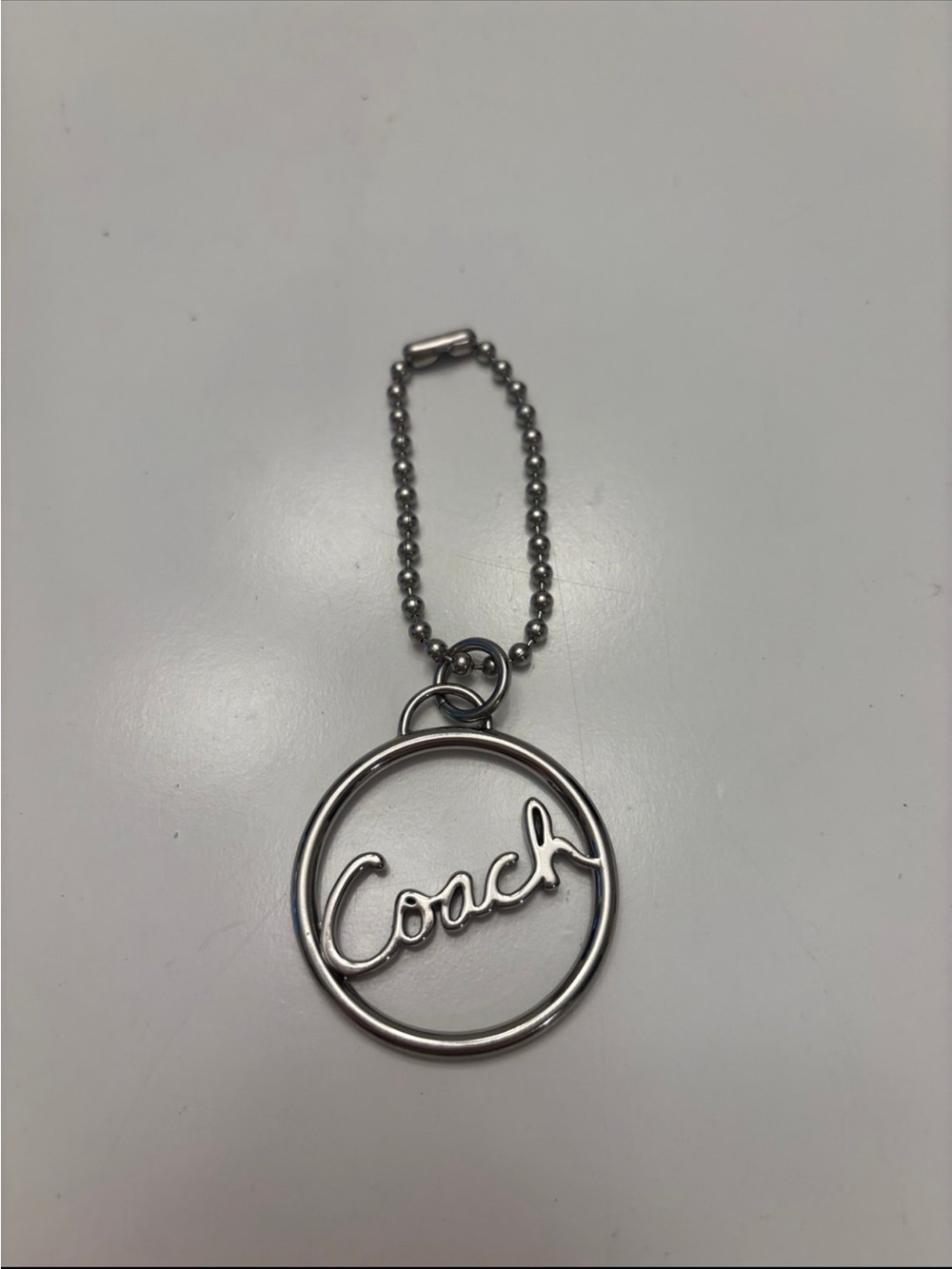 Coach Silver Script Circle Keychain